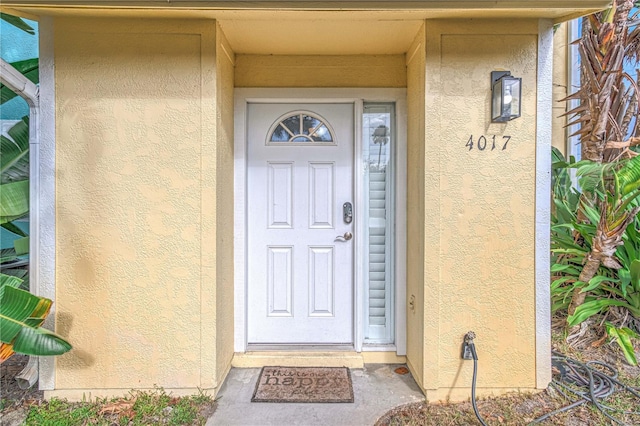 4017 Saxon Dr, New Smyrna Beach, FL 32169 - view of exterior entry with stucco siding