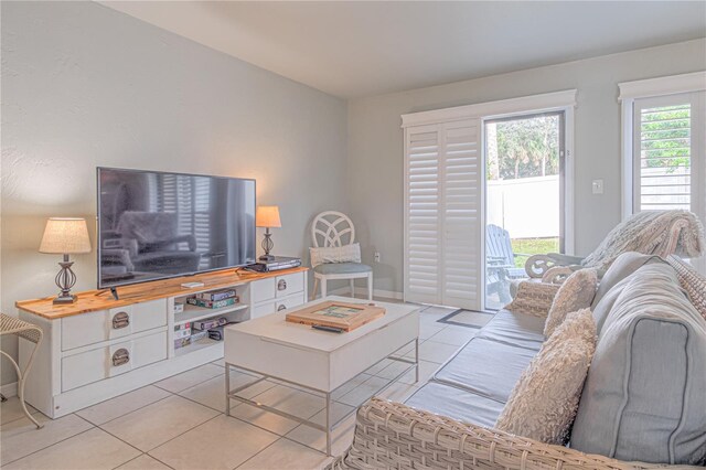 4017 Saxon Dr, New Smyrna Beach, FL 32169 - living room featuring light tile patterned flooring