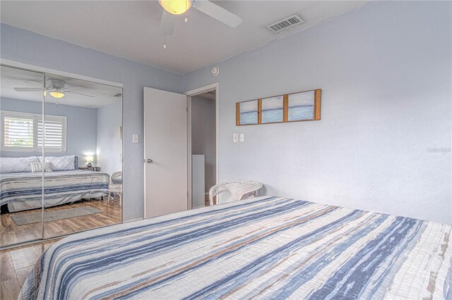 4017 Saxon Dr, New Smyrna Beach, FL 32169 - bedroom with a ceiling fan, wood finished floors, and a closet