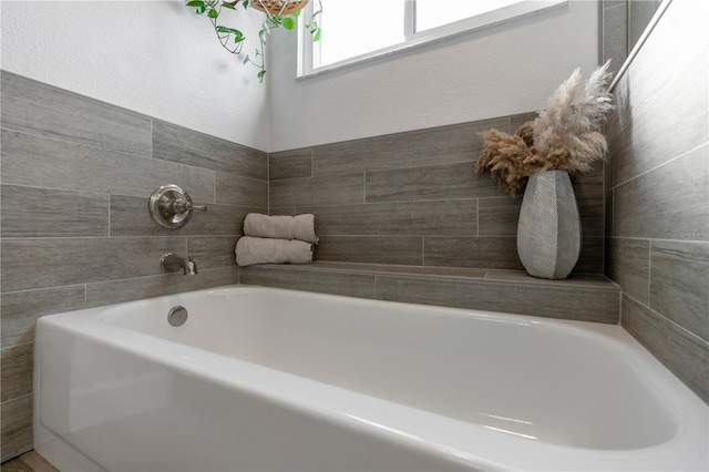 bathroom featuring a washtub