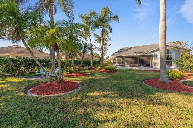 view of yard featuring a sunroom