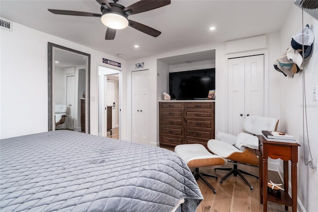 bedroom featuring hardwood / wood-style floors and ceiling fan