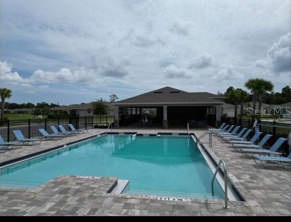 view of swimming pool featuring a patio area