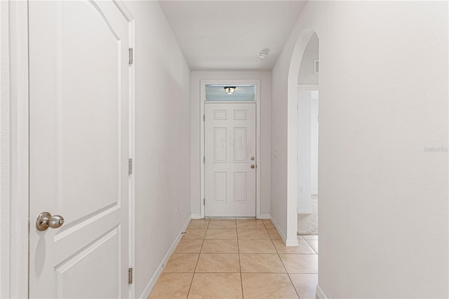 hallway featuring light tile patterned floors