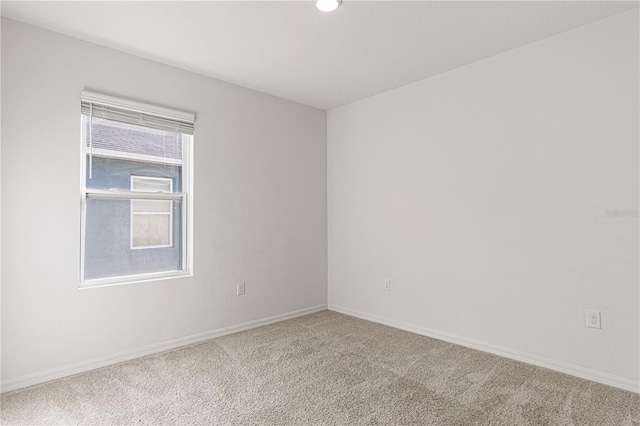 unfurnished room featuring carpet floors