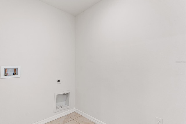 laundry room featuring electric dryer hookup, washer hookup, and light tile patterned floors