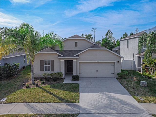 view of front of home featuring a garage and a front yard