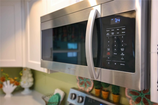 interior details featuring white cabinetry