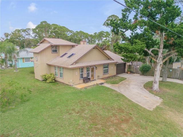 rear view of property featuring a lawn