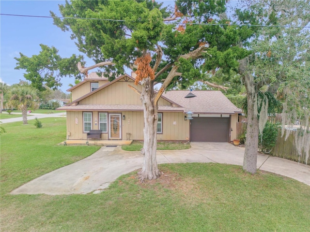 view of front of house featuring a garage and a front lawn