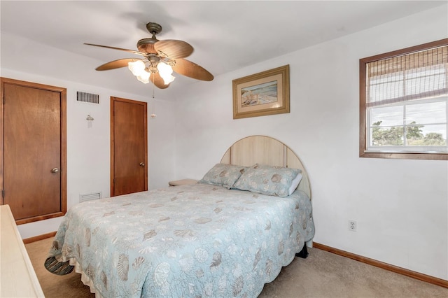 carpeted bedroom featuring ceiling fan