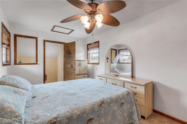 carpeted bedroom featuring ceiling fan