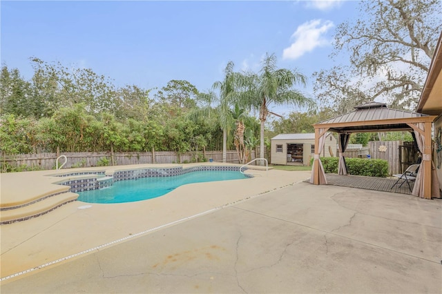 view of pool with a gazebo, a patio area, and an in ground hot tub