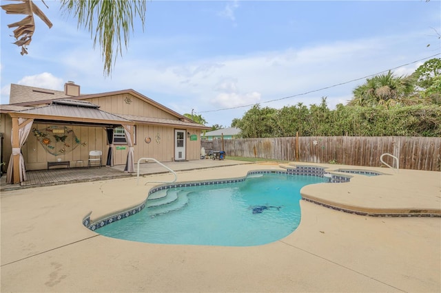 view of swimming pool with a gazebo and a patio area