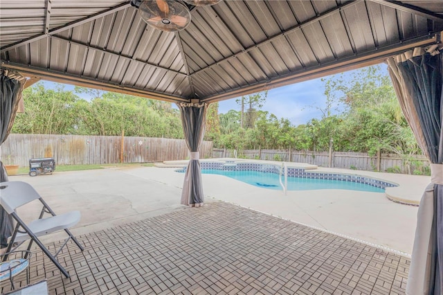 view of pool with a patio area and ceiling fan