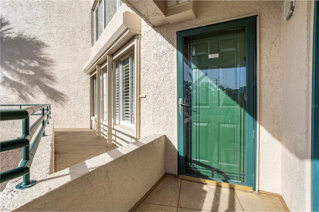 entrance to property with a balcony