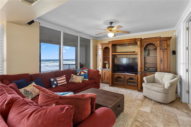 living room with crown molding and ceiling fan