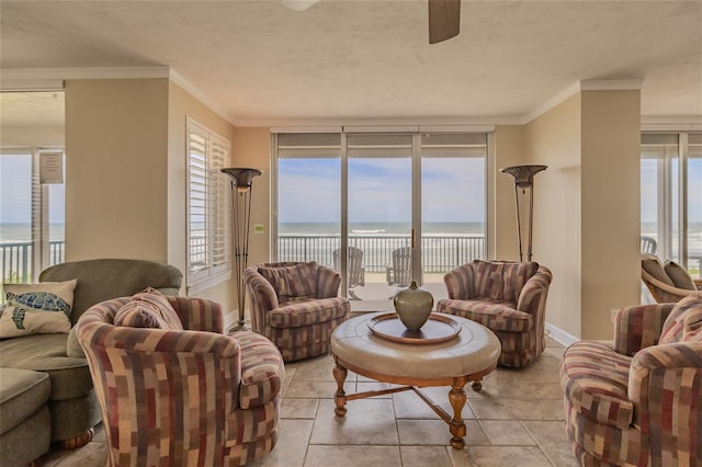 living room featuring crown molding, ceiling fan, and a water view