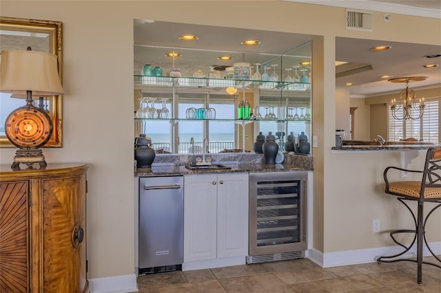 bar featuring white cabinetry, light tile patterned floors, wine cooler, and dark stone counters