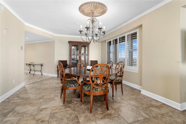 dining space with crown molding and an inviting chandelier