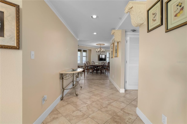 hall with crown molding, light tile patterned floors, and a chandelier