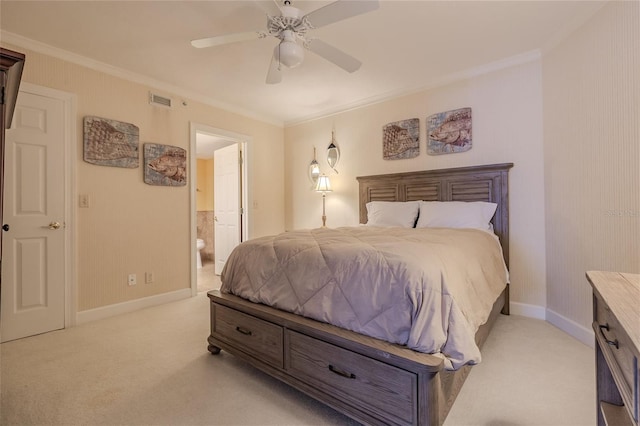 bedroom featuring ceiling fan, ornamental molding, connected bathroom, and light carpet