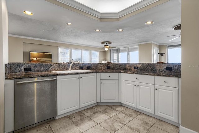 kitchen featuring white cabinets, sink, dark stone counters, and dishwasher