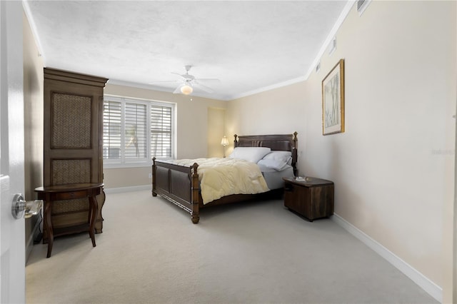 carpeted bedroom featuring crown molding and ceiling fan