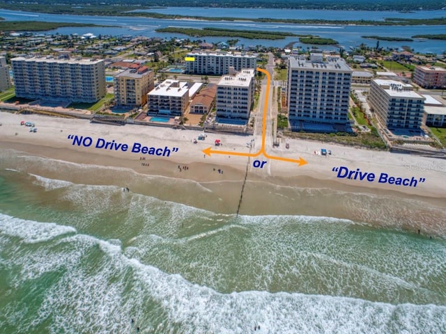 aerial view featuring a water view and a view of the beach