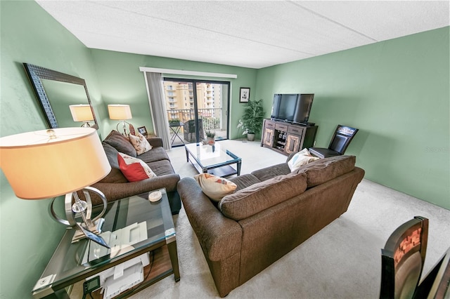 carpeted living room with a textured ceiling