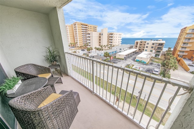 balcony featuring a water view