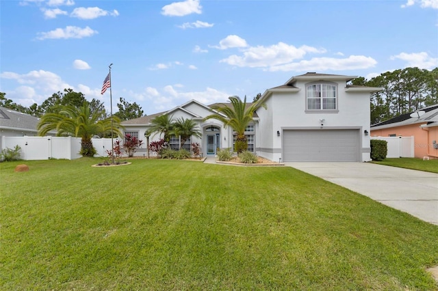 view of front of home featuring a front yard and a garage