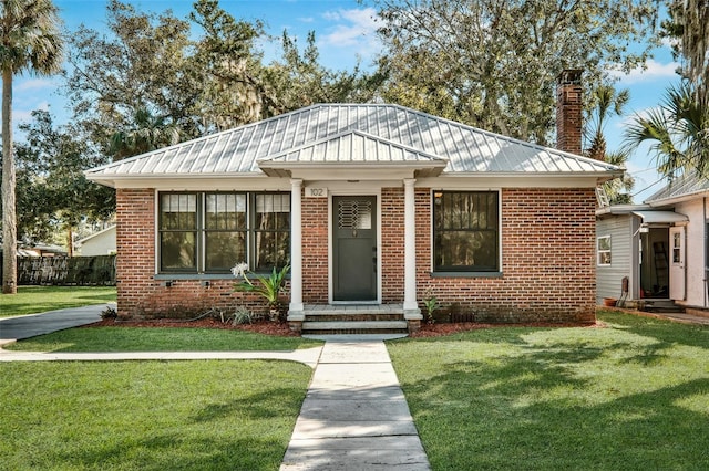 bungalow with a front yard