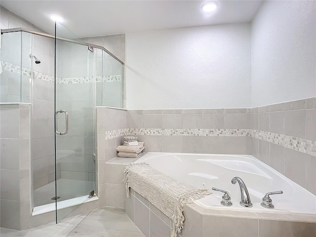 bathroom with independent shower and bath