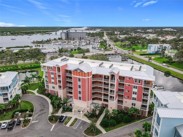 birds eye view of property featuring a water view