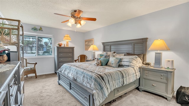 4411 Sea Mist Ct Unit 275, New Smyrna Beach, FL 32169 - bedroom featuring light colored carpet, ceiling fan, and a textured ceiling