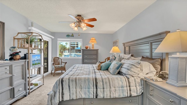 4411 Sea Mist Ct Unit 275, New Smyrna Beach, FL 32169 - carpeted bedroom with a textured ceiling and a ceiling fan