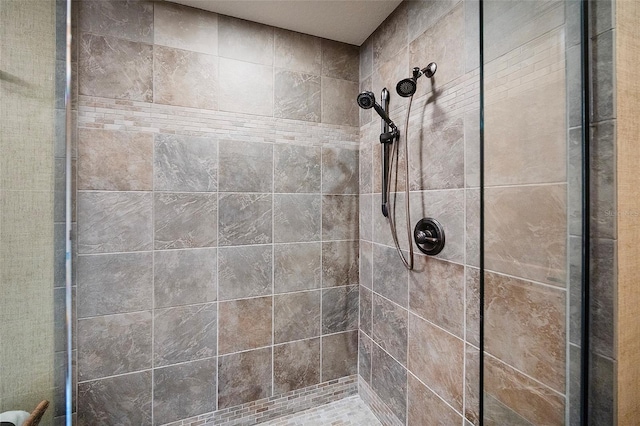 bathroom with tiled shower