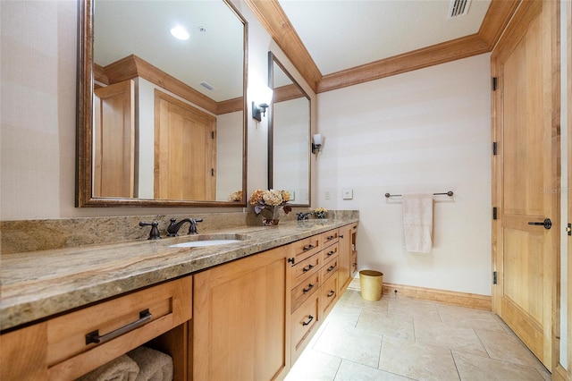 bathroom with vanity and ornamental molding