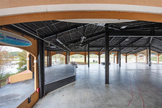 interior space with concrete floors and vaulted ceiling