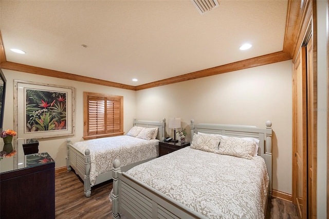 bedroom featuring dark hardwood / wood-style floors and ornamental molding