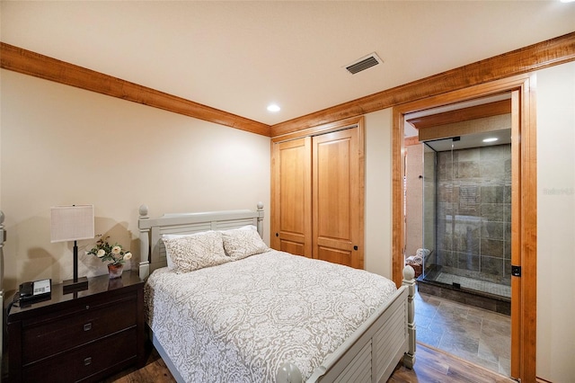 bedroom with a closet and dark wood-type flooring