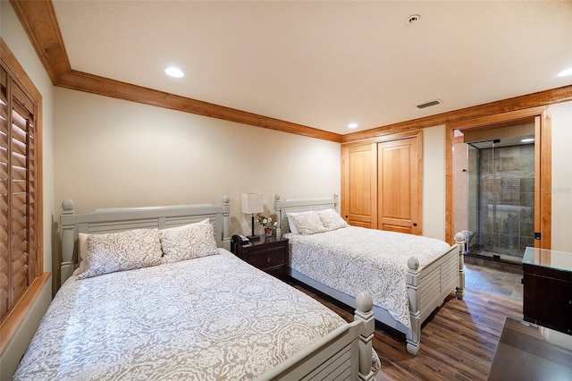 bedroom with dark hardwood / wood-style flooring