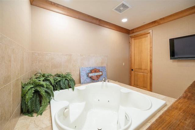 bathroom featuring a tub and tile walls