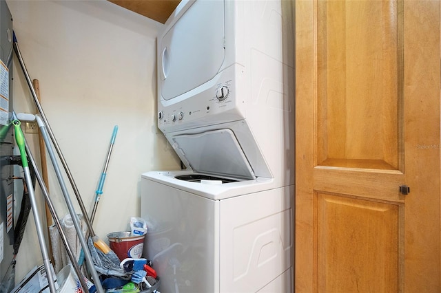 laundry area featuring stacked washer and dryer