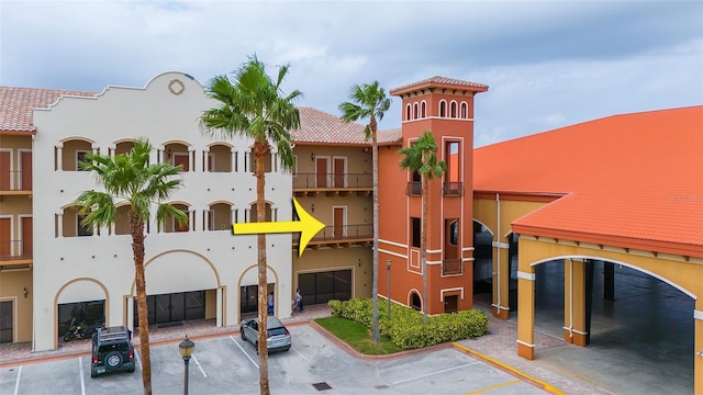 1653 N US Highway 1 Unit 201, Ormond Beach, FL 32174 - view of property featuring uncovered parking