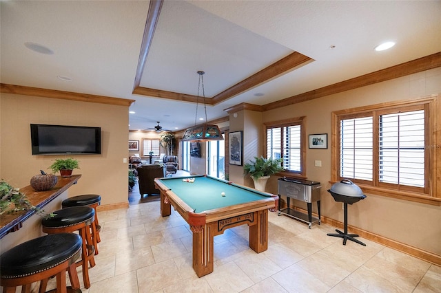 playroom with ceiling fan, billiards, crown molding, a tray ceiling, and light tile patterned flooring