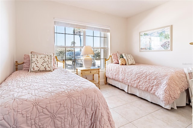 bedroom with light tile patterned floors