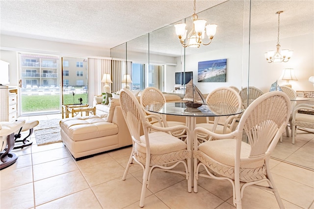 dining room featuring a notable chandelier, light tile patterned flooring, and a textured ceiling