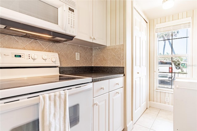 kitchen featuring white appliances, backsplash, white cabinetry, and light tile patterned flooring